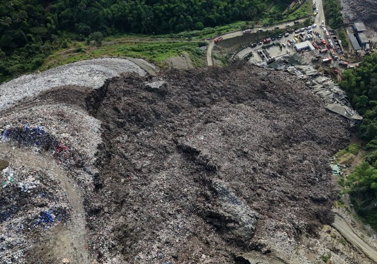 Massive landfill COLLAPSES killing at least one with 38 others missing in avalanche of toxic trash in Philippines