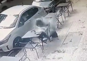 Shock moment man is knocked out cold as he’s smashed in the head by falling glass pane while having a drink outside bar