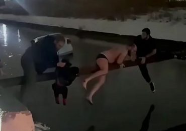 Watch incredible moment boy is saved from sinking taxi after it veered off road & plunged into canal