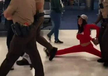 Shocking moment ‘drunk’ OnlyFans models are dragged off packed plane after doing splits and causing chaos onboard