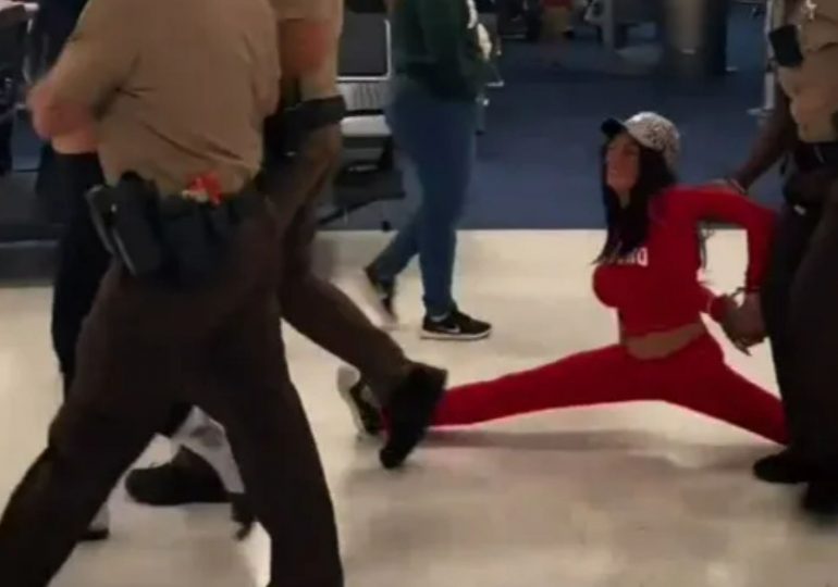 Shocking moment ‘drunk’ OnlyFans models are dragged off packed plane after doing splits and causing chaos onboard