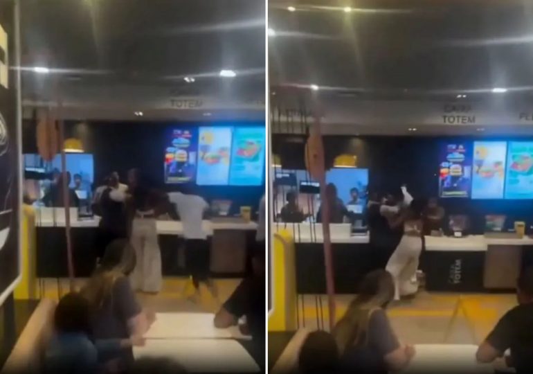 Shocking moment McDonald’s customer launches flying kick at worker as punches are thrown & burgers hurled in mass brawl