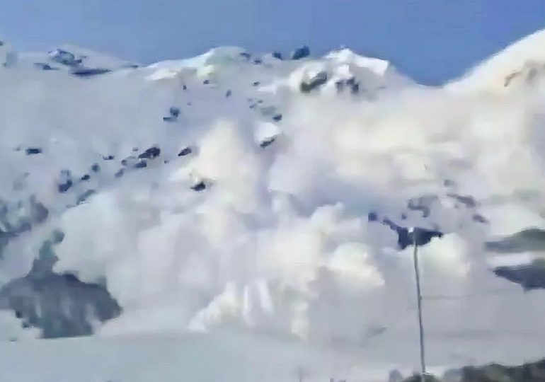 Terrifying moment enormous avalanche engulfs ski resort sweeping up desperate tourists unable to escape wall of snow