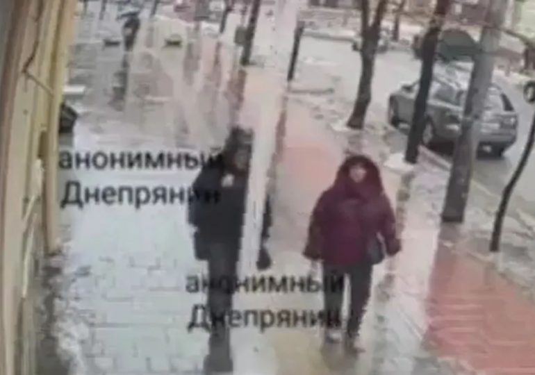 Heartstopping moment huge 5ft icicle snaps off building above two women walking in street below & misses them by an INCH