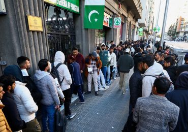 Huge crowds of male migrants gather for docs after socialist Spain offers legal status to 500,000…as Elon Musk weighs in