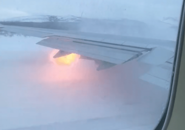Terrifying moment flames shoot from plane wing as pilot aborts takeoff at last minute before packed jet skids off runway