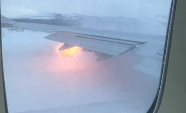 Terrifying moment flames shoot from plane wing as pilot aborts takeoff at last minute before packed jet skids off runway
