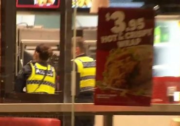 KFC customer ‘bites cop’s EAR’ after police rush to restaurant when he leapt over counter in terrifying rampage