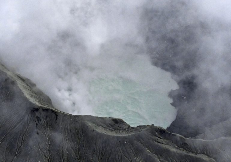 Missing tourist helicopter found stranded near active volcano crater spewing fumes & hampering rescue mission in Japan