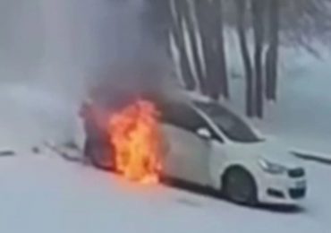 Dramatic moment football star smashes window of car to save trapped boy, 7, as flames engulf vehicle