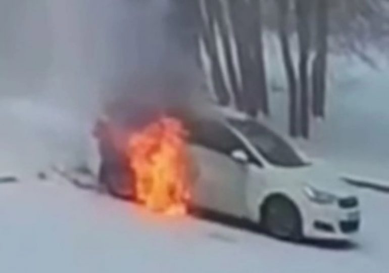 Dramatic moment football star smashes window of car to save trapped boy, 7, as flames engulf vehicle