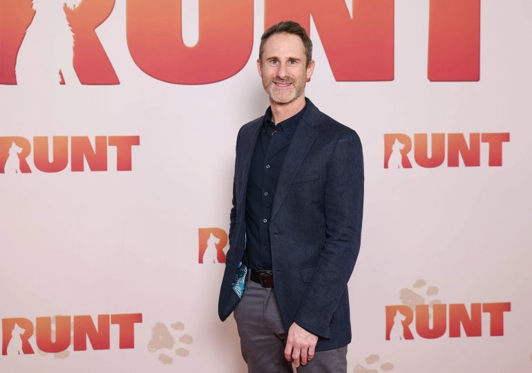 Best-selling author charged with possessing and distributing child exploitation material after police raided his home