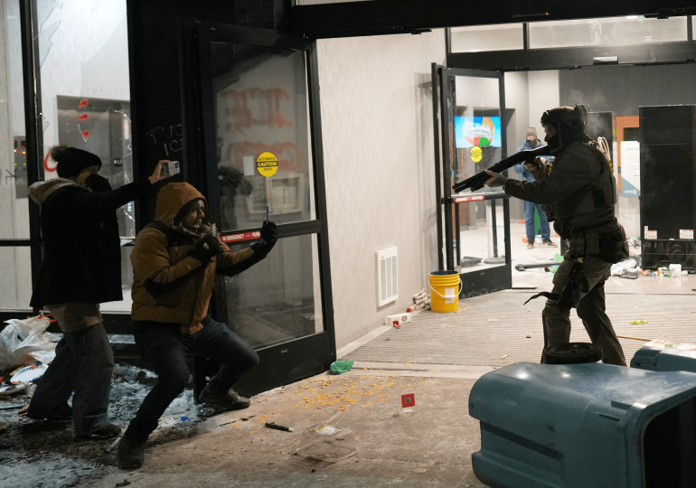 Protesters swarm Minnesota hotel after Alex Pretti shooting leaving officer bloodied as windows smashed & tear gas fired