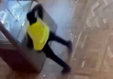 Dramatic CCTV footage shows the moment brazen thief smashes display case in Louvre in £76million crown jewel heist