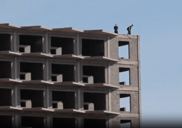 Horror moment idiot Brit tourists risk their lives to take selfies from roof of abandoned 22-storey Tenerife hotel