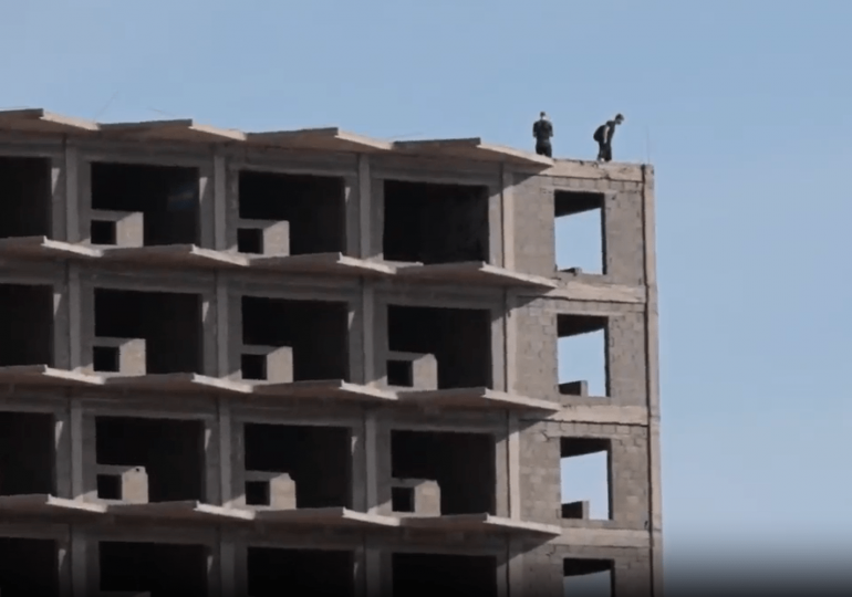 Horror moment idiot Brit tourists risk their lives to take selfies from roof of abandoned 22-storey Tenerife hotel