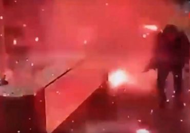 Terrifying moment parcel explodes in apartment reception just after being delivered to desk as two injured