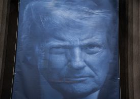 ‘Beyond Parody’: Democrats Criticize Giant Trump Banner Hung at Justice Department Headquarters