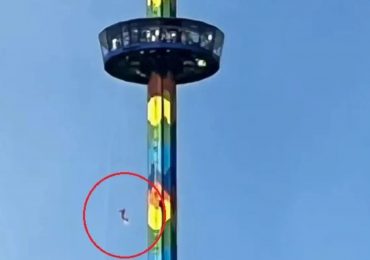 Stomach-churning moment terrified tourists dangle 200ft in air from spinning ride after it breaks down mid-air