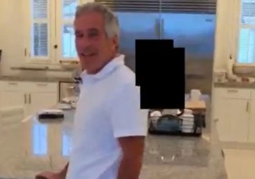 Disturbing new footage shows Epstein laughing as he chases young women around kitchen on notorious paedo island