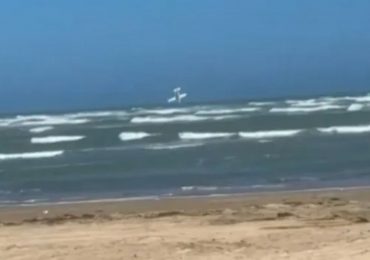 Horrifying moment plane nosedives into sea in front of shocked beachgoers killing pilot and two teenage passengers