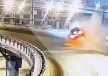Horrifying moment speeding Mercedes smashes through flyover barrier and plunges 35ft onto car below leaving two dead